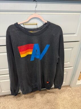 Aviator Nation Black Crewneck Sweatshirt with Rainbow AV Graphic